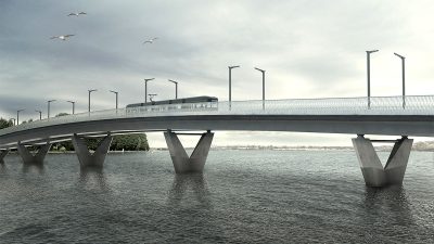 Havainnekuva, jossa sillalla kulkee ratikka.